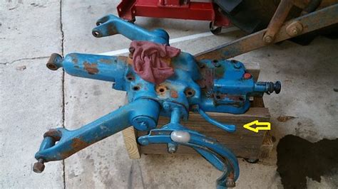although they use an electronic scale bar in the place of a spring, and the hydraulic valve is operated electronically, the <b>draft</b> <b>control</b> on new tractors are adjusted in the same manner as dual <b>lever</b> units. . Ford 8n draft position control lever
